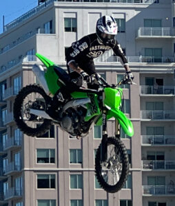 Reference photo of a motocross rider mid-jump, the customer photo behind Jackalope Jump
